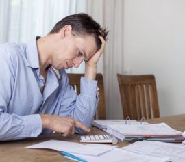 Man is feeling depressed on financial pressure.